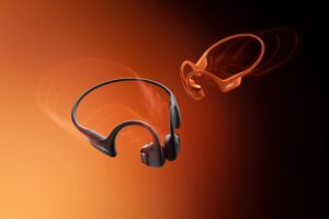 OpenRun Pro 2 Serie Bügel Kopfhörer von shokz in orange und schwarz vor orangem-schwarzem Hintergrund